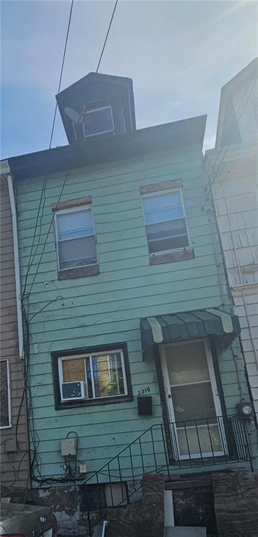 a brick house with four windows