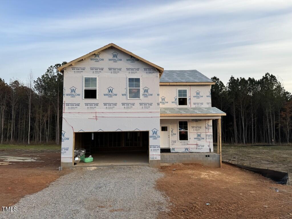 a front view of a house with a garage