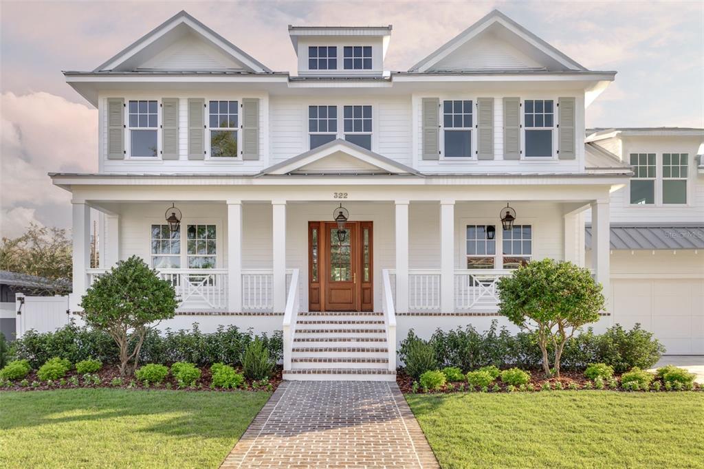 front view of a house with a yard