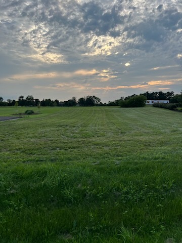 a view of an ocean and a yard