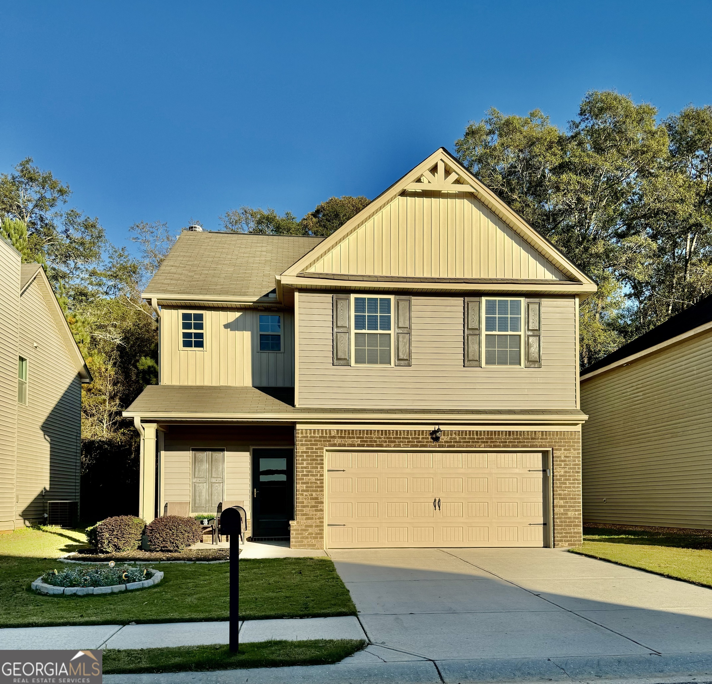 a front view of a house with a yard