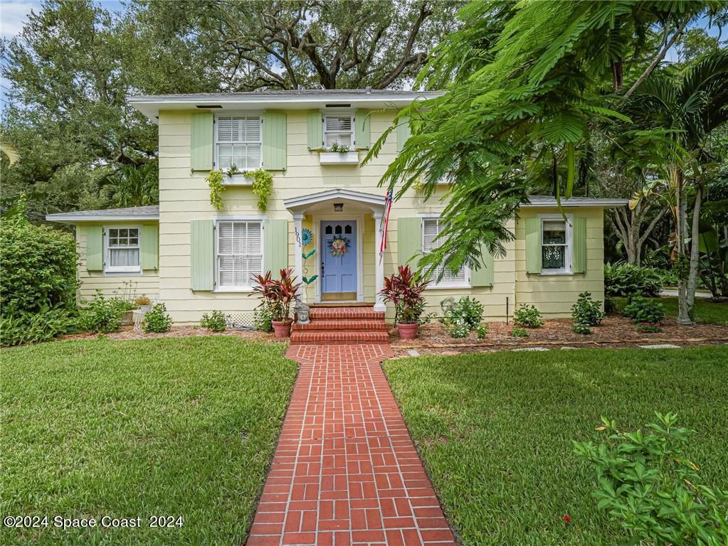 a front view of a house with a yard