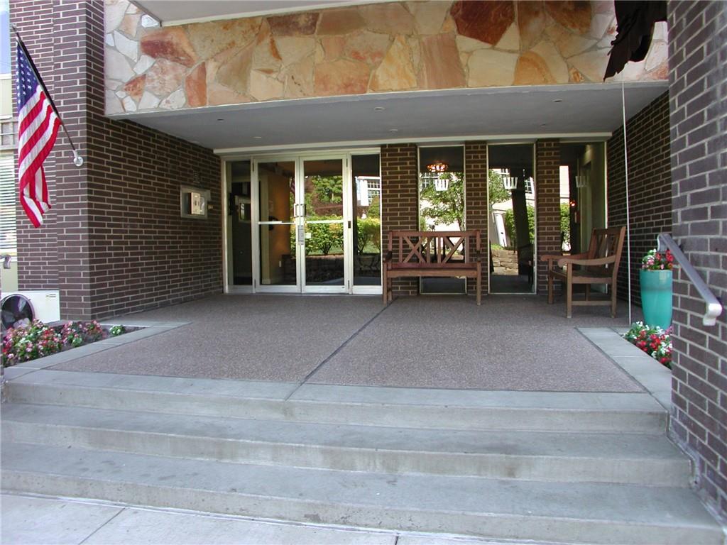 a view of a building with sitting area