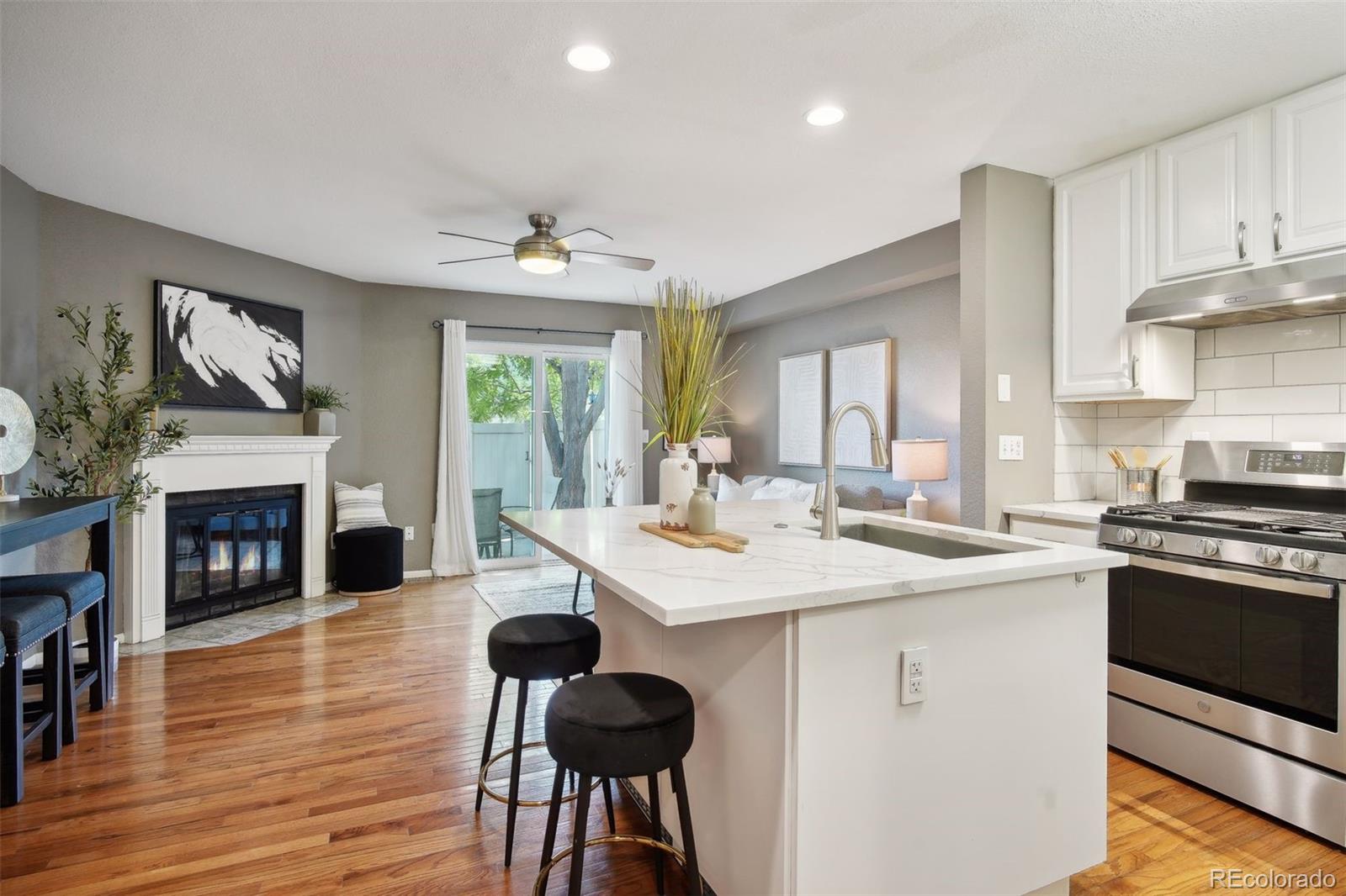 a kitchen with a stove a sink and a refrigerator