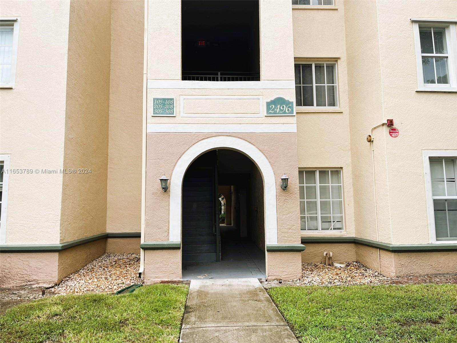 a view of front door of house with yard