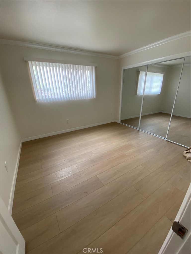 a view of an empty room with windows