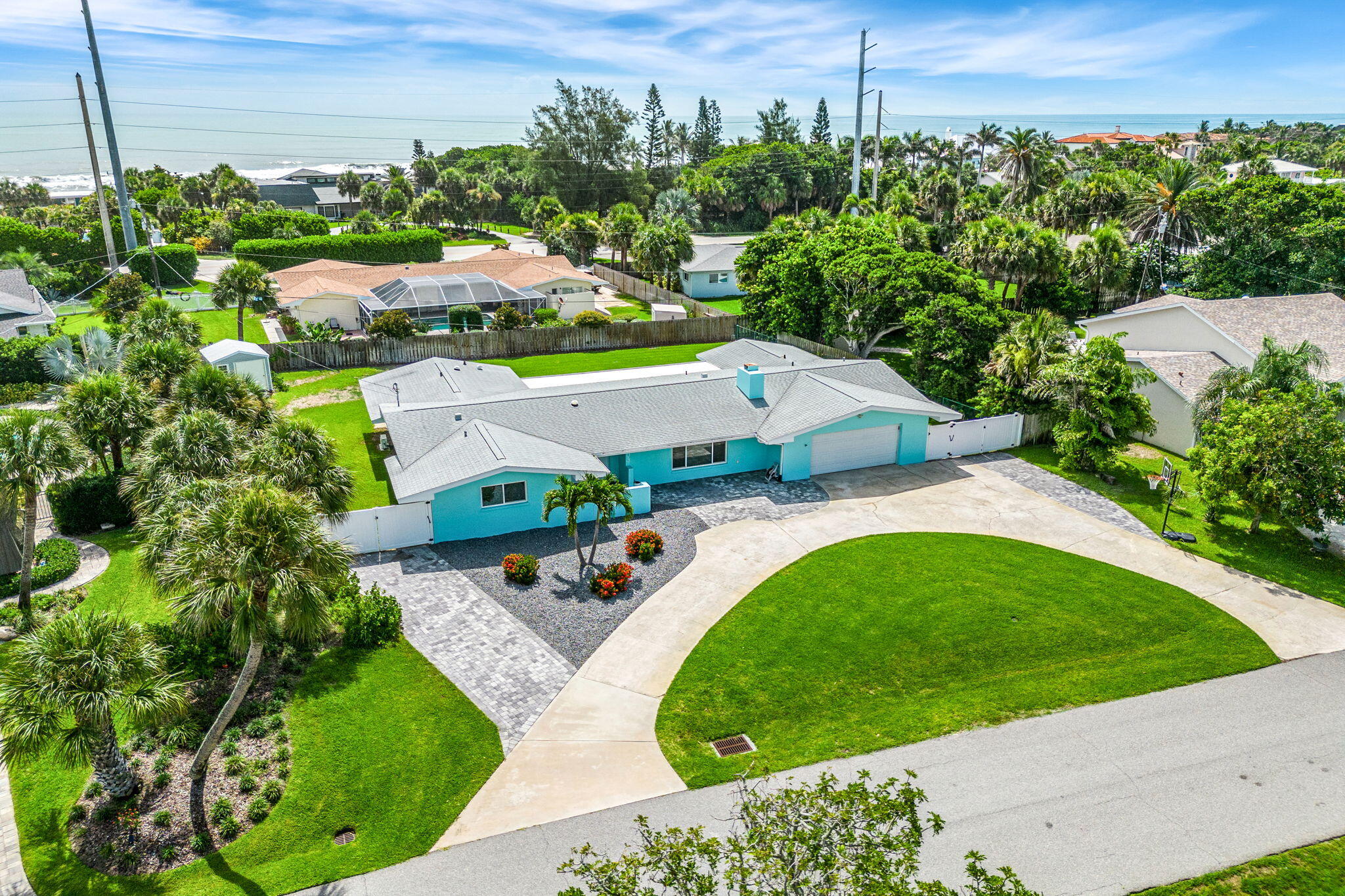 an aerial view of a house with a garden