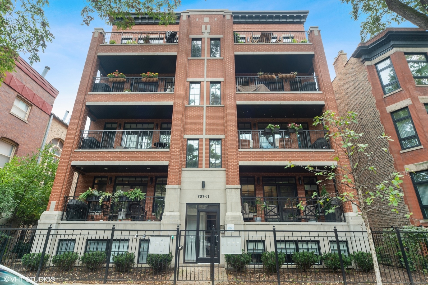 a front view of a building with a garden