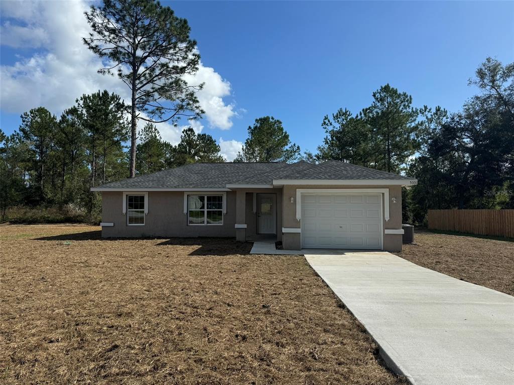 front view of a house with a yard