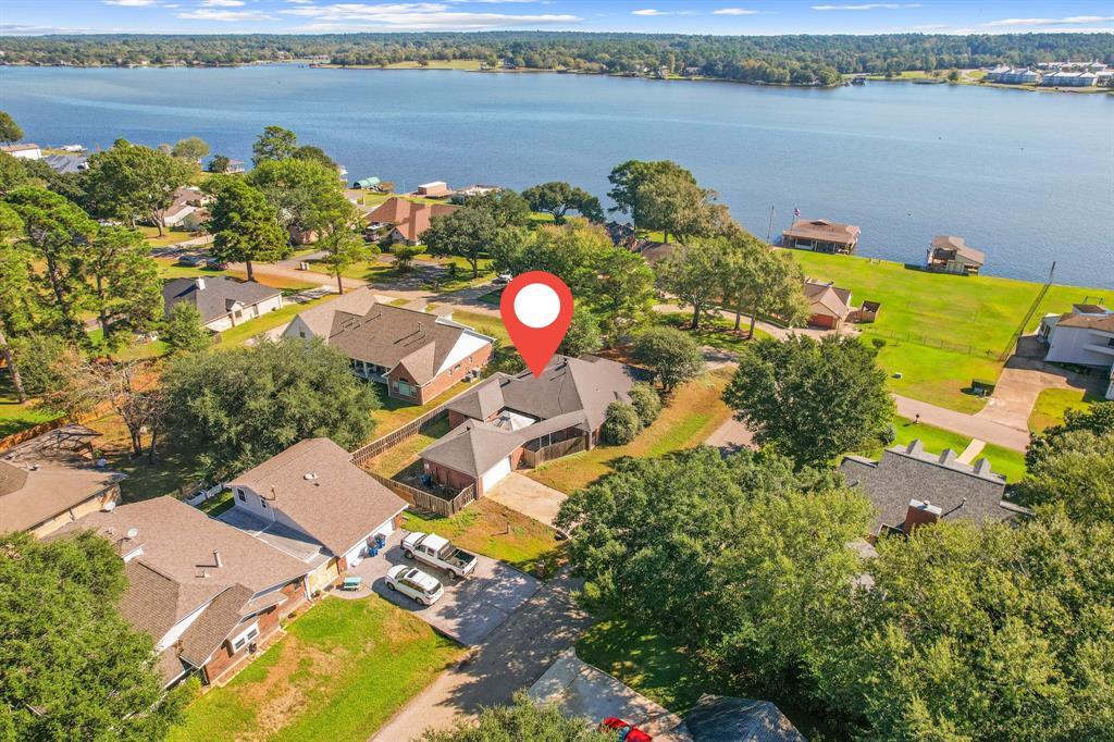 an aerial view of a house with a lake view