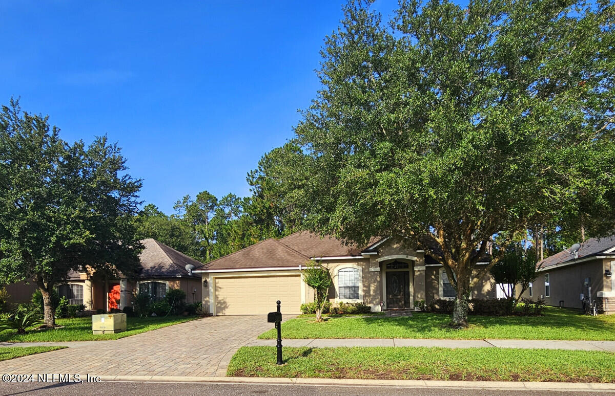 a front view of a house with a yard