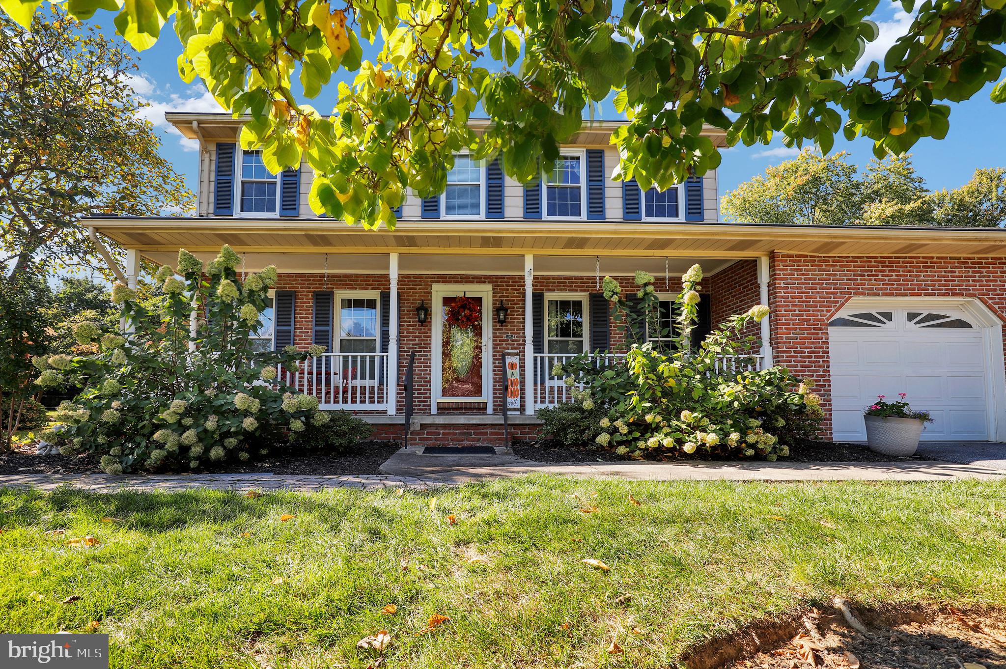 front view of a house with a garden