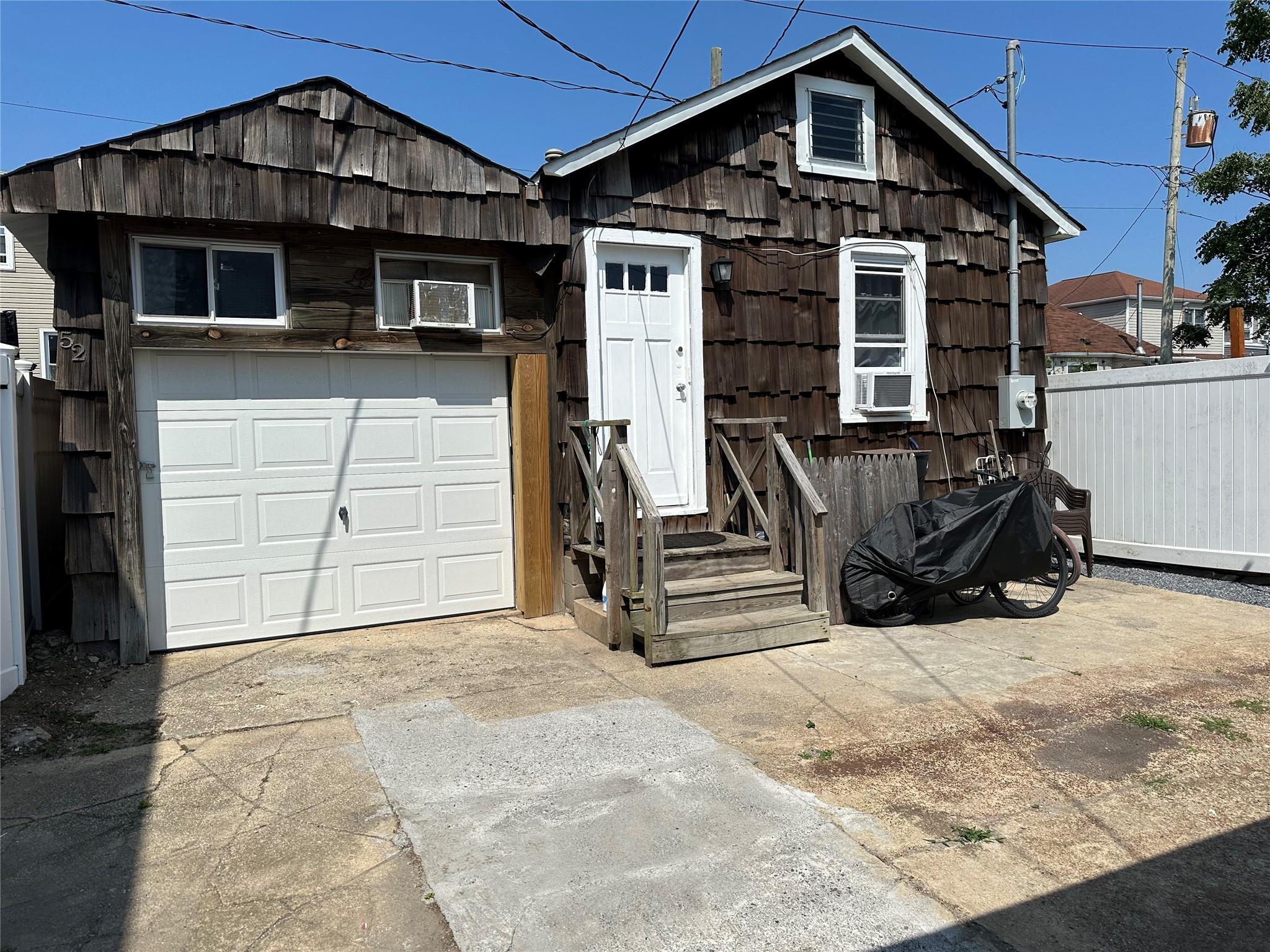 a front view of a house with garage