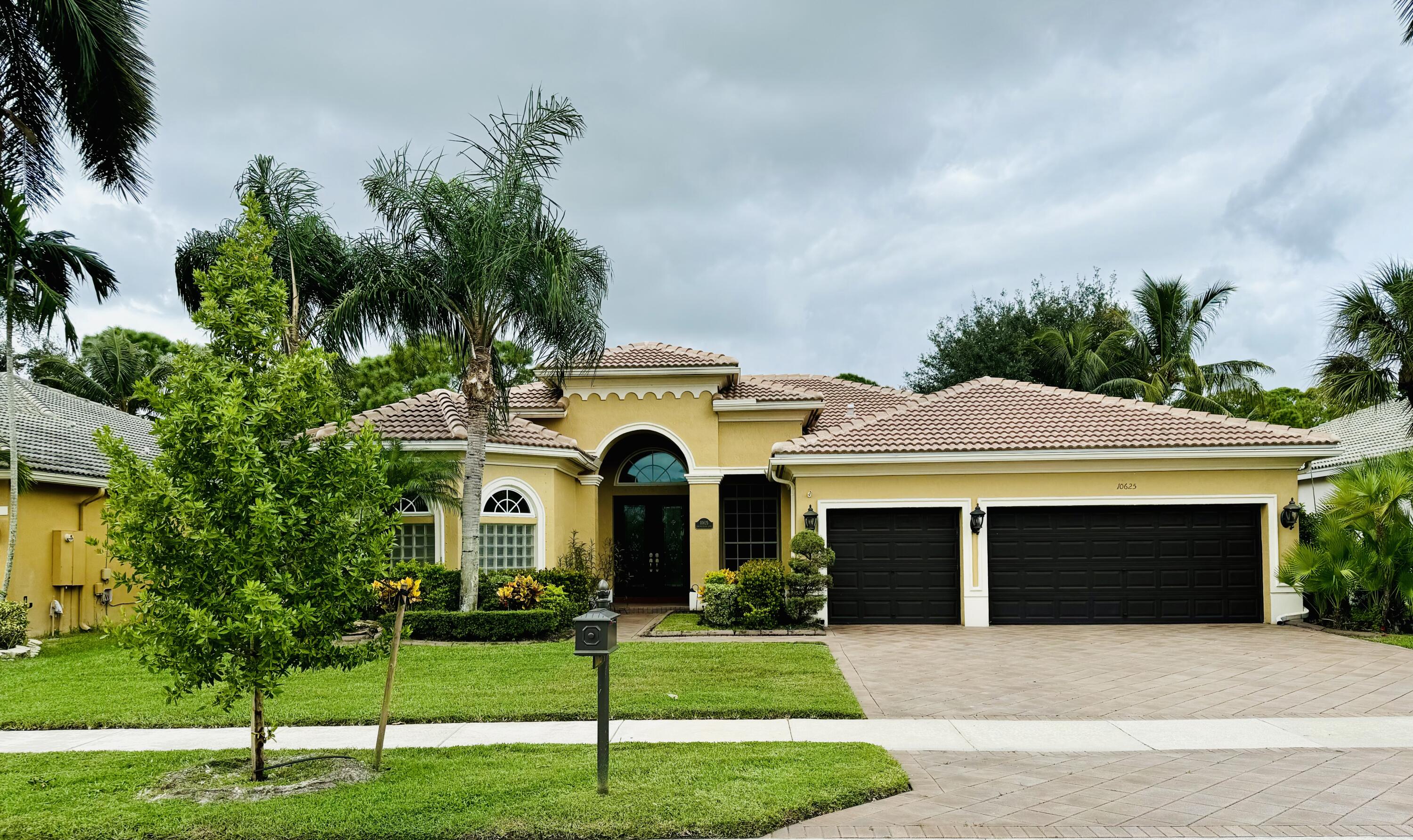 a front view of a house with a yard