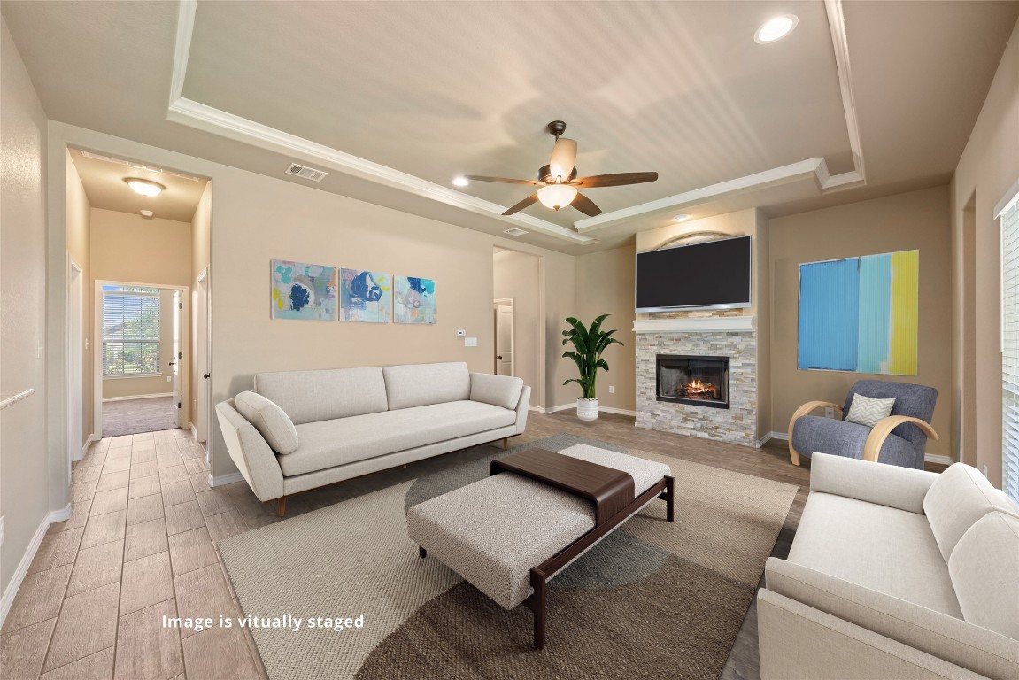 a living room with furniture and a fireplace