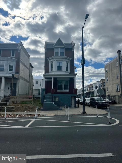 a view of a big building next to a road