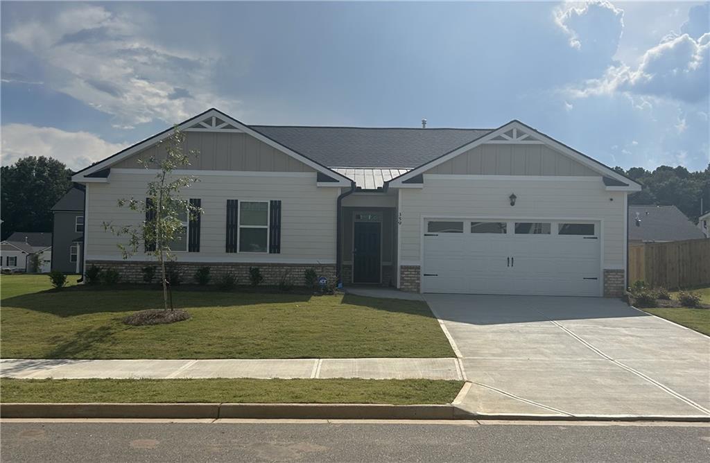 a front view of a house with a yard