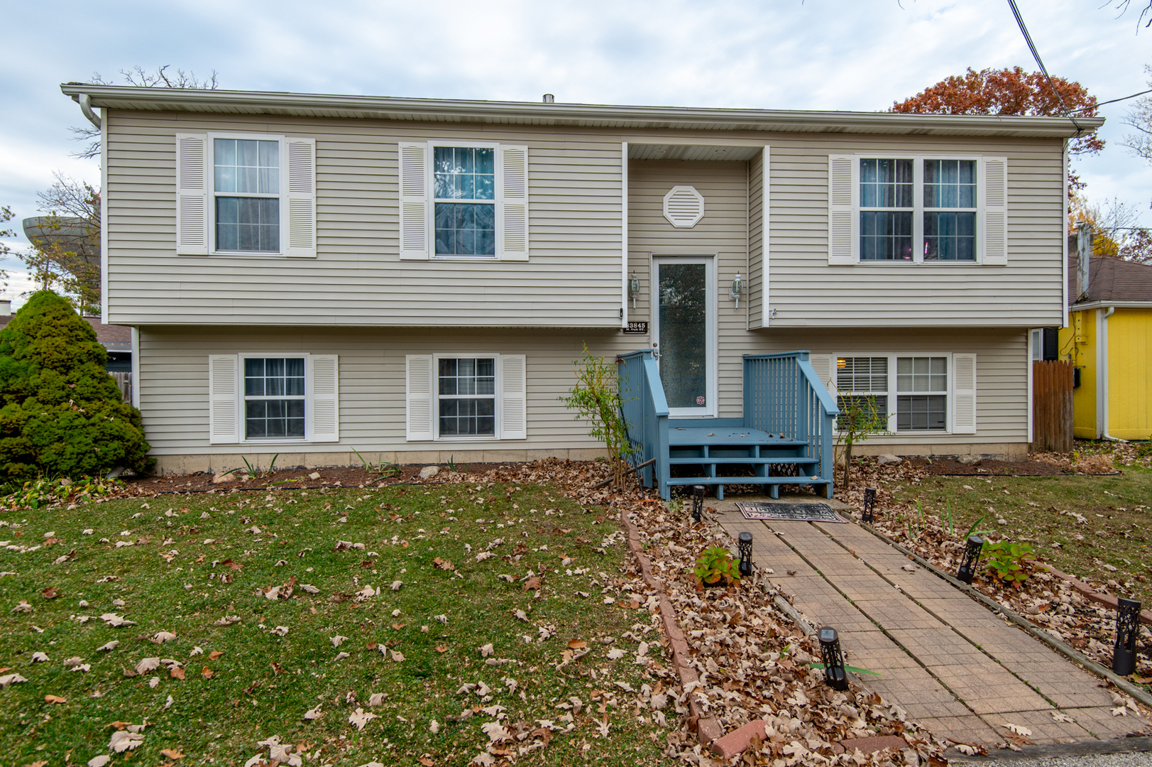 front view of a house with a yard