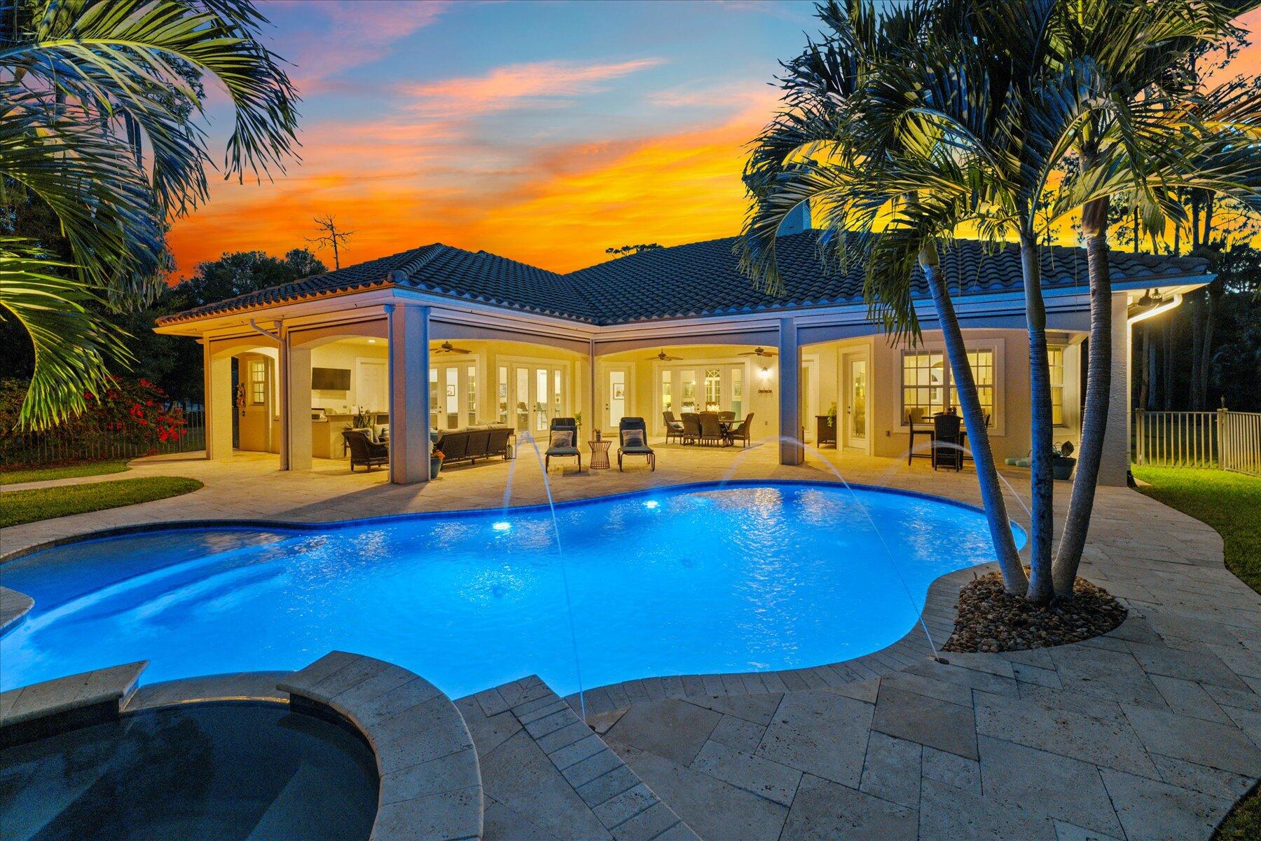 a view of swimming pool with outdoor seating