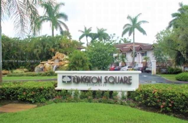 a view of outdoor space with sign board and garden