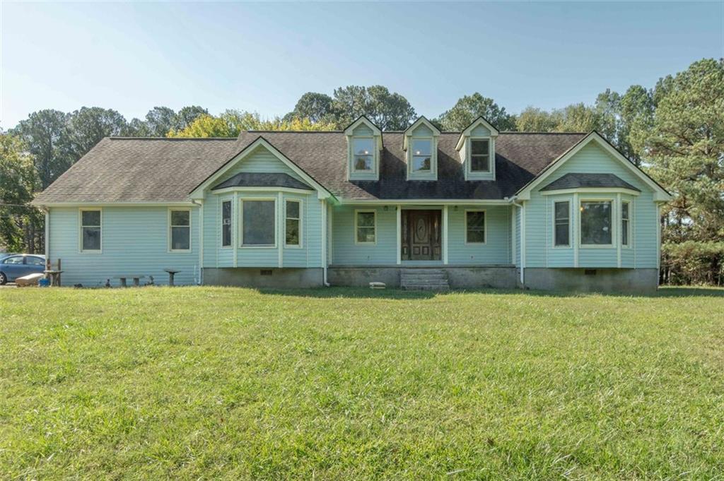 front view of a house with a yard