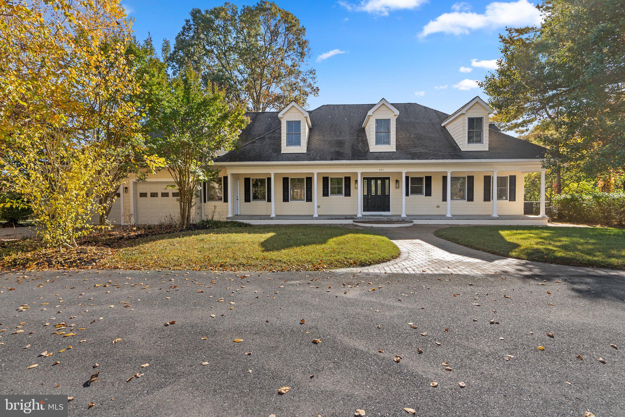 a view of a house with swimming pool and porch