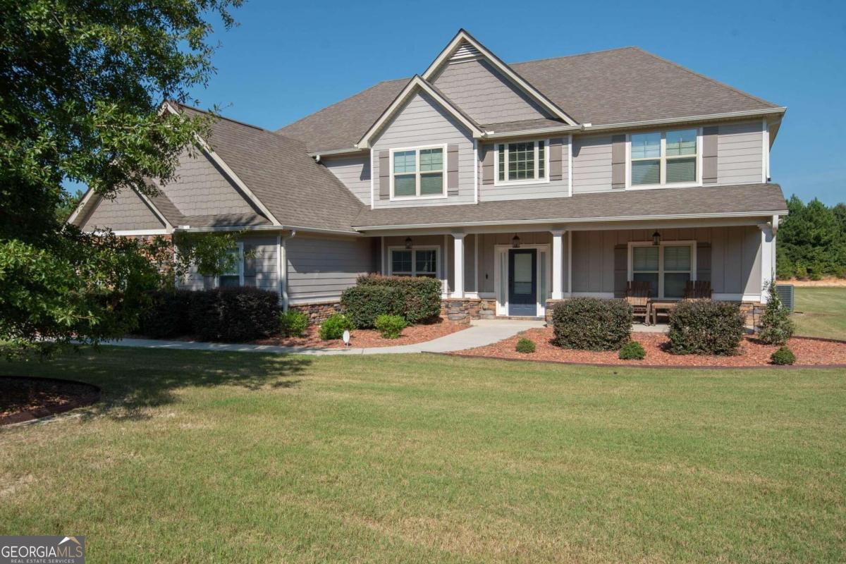 a front view of a house with a yard