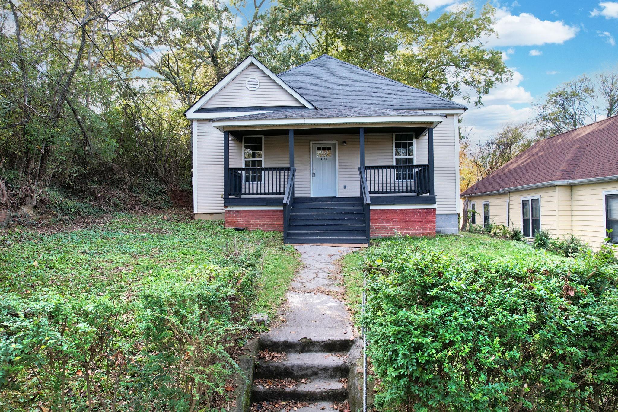 a front view of a house with garden