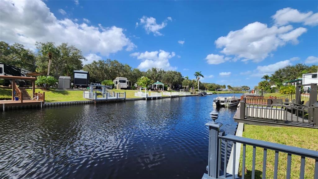 a view of a lake with houses in the back