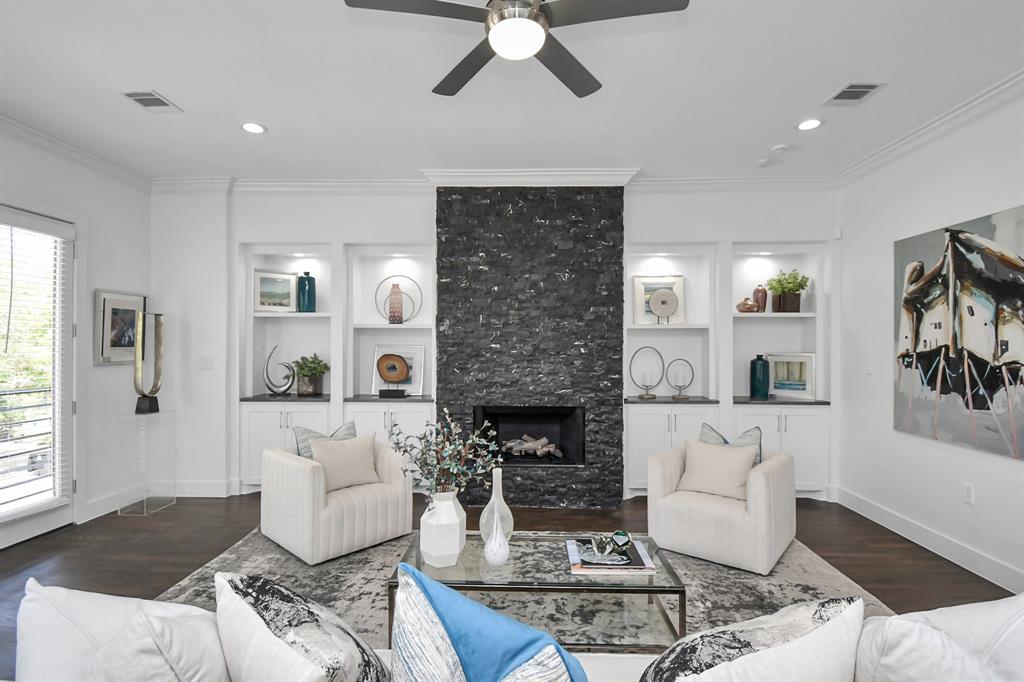 Gather with loved ones around the newly remodeled custom stone stacked gas log fireplace in the stunning second-floor family room, designed for both warmth and visual appeal.