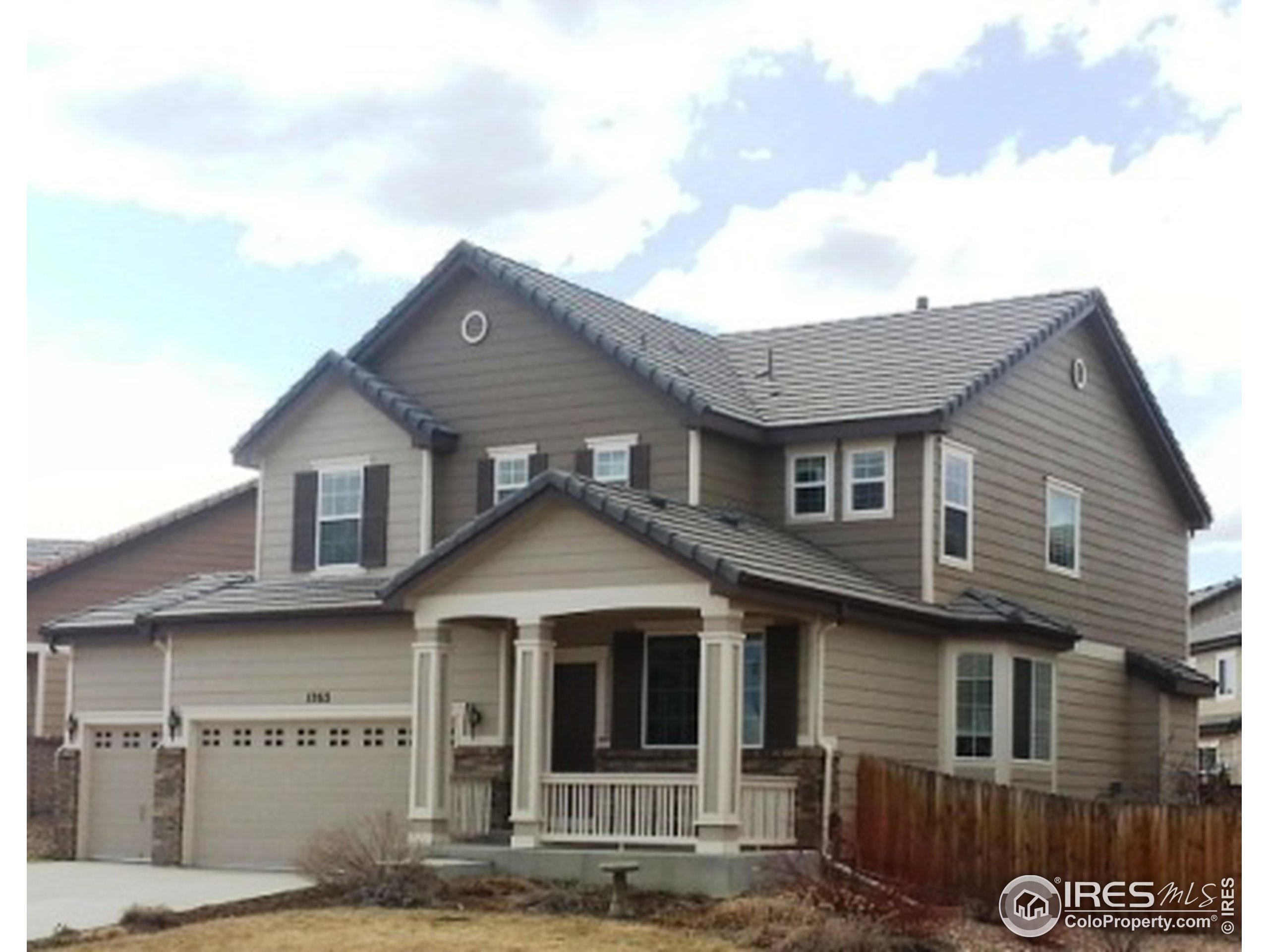 a front view of a house with a garage