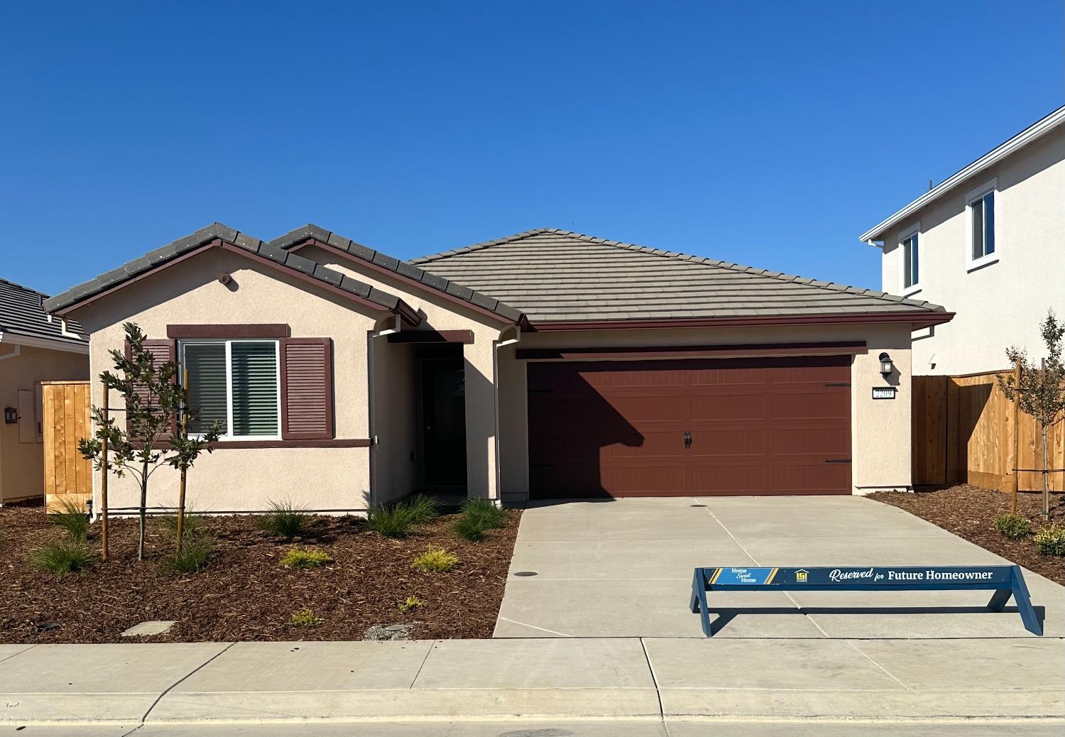 a front view of a house with a garage