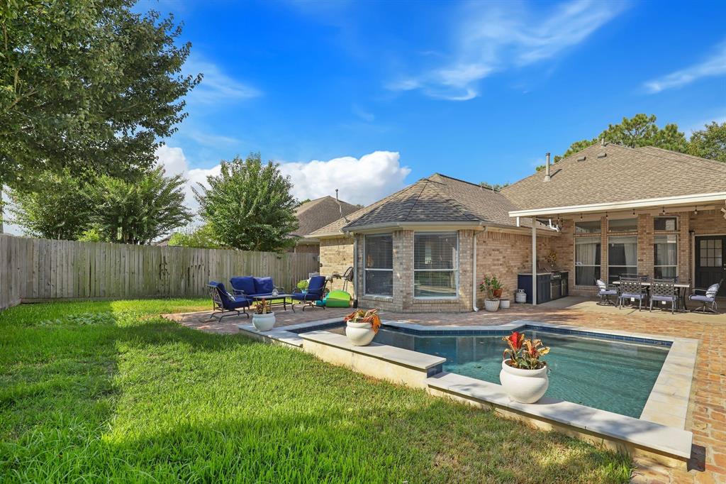 a front view of house with yard and seating area