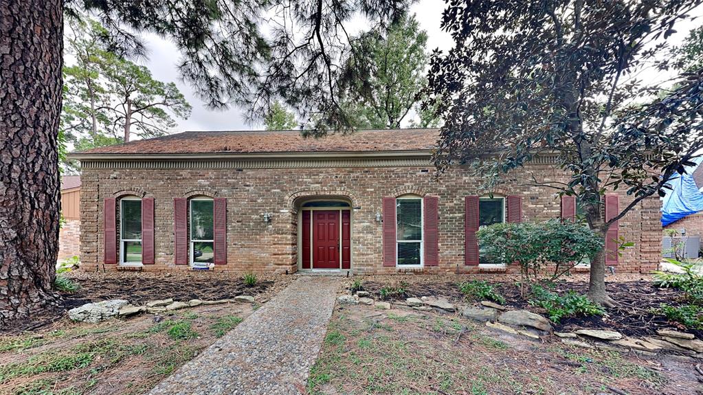 front view of house with a tree