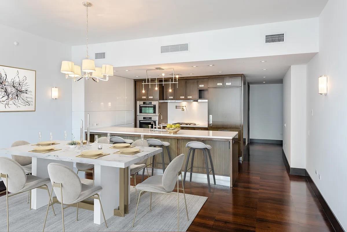 a kitchen with a table and chairs in it