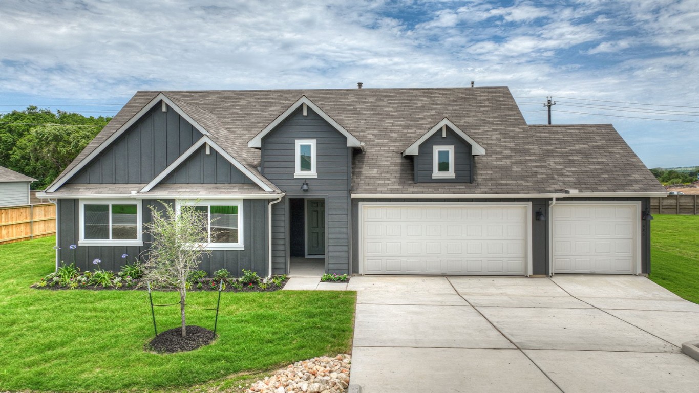 front view of a house with a yard