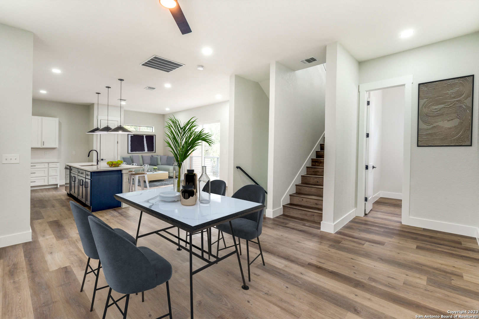 a view of a dining room with furniture and wooden floor