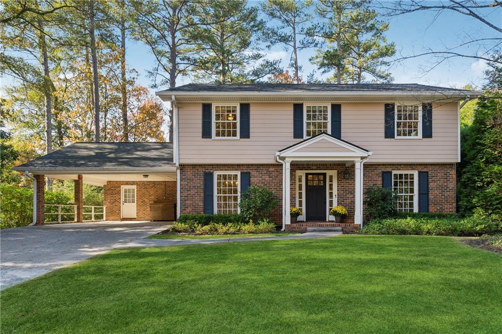 front view of a house with a yard