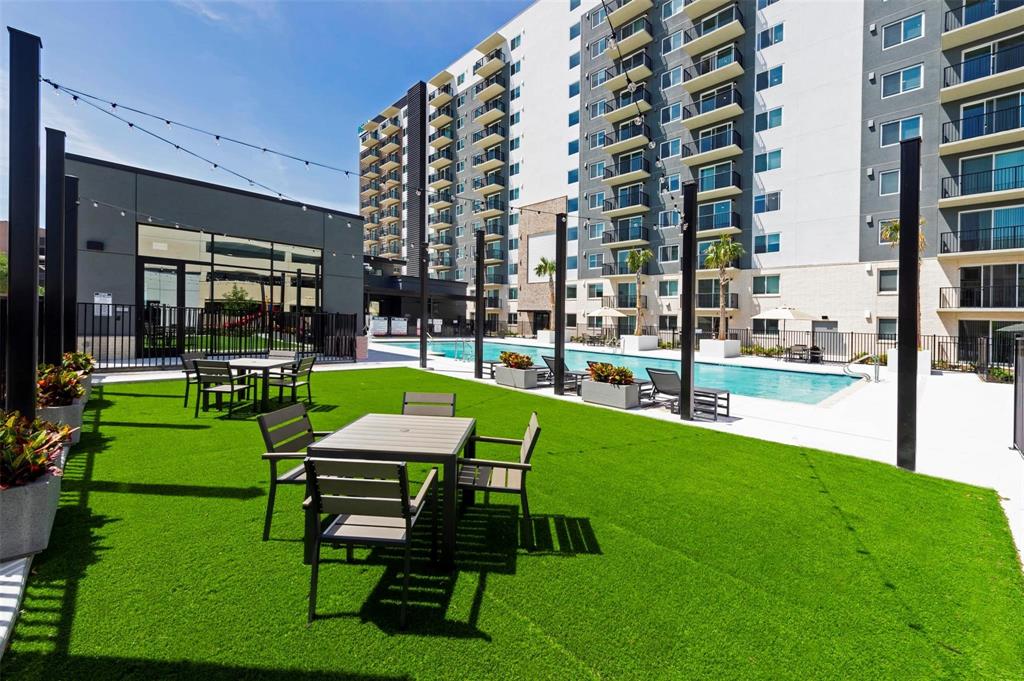 a sitting area with a table and chairs in patio