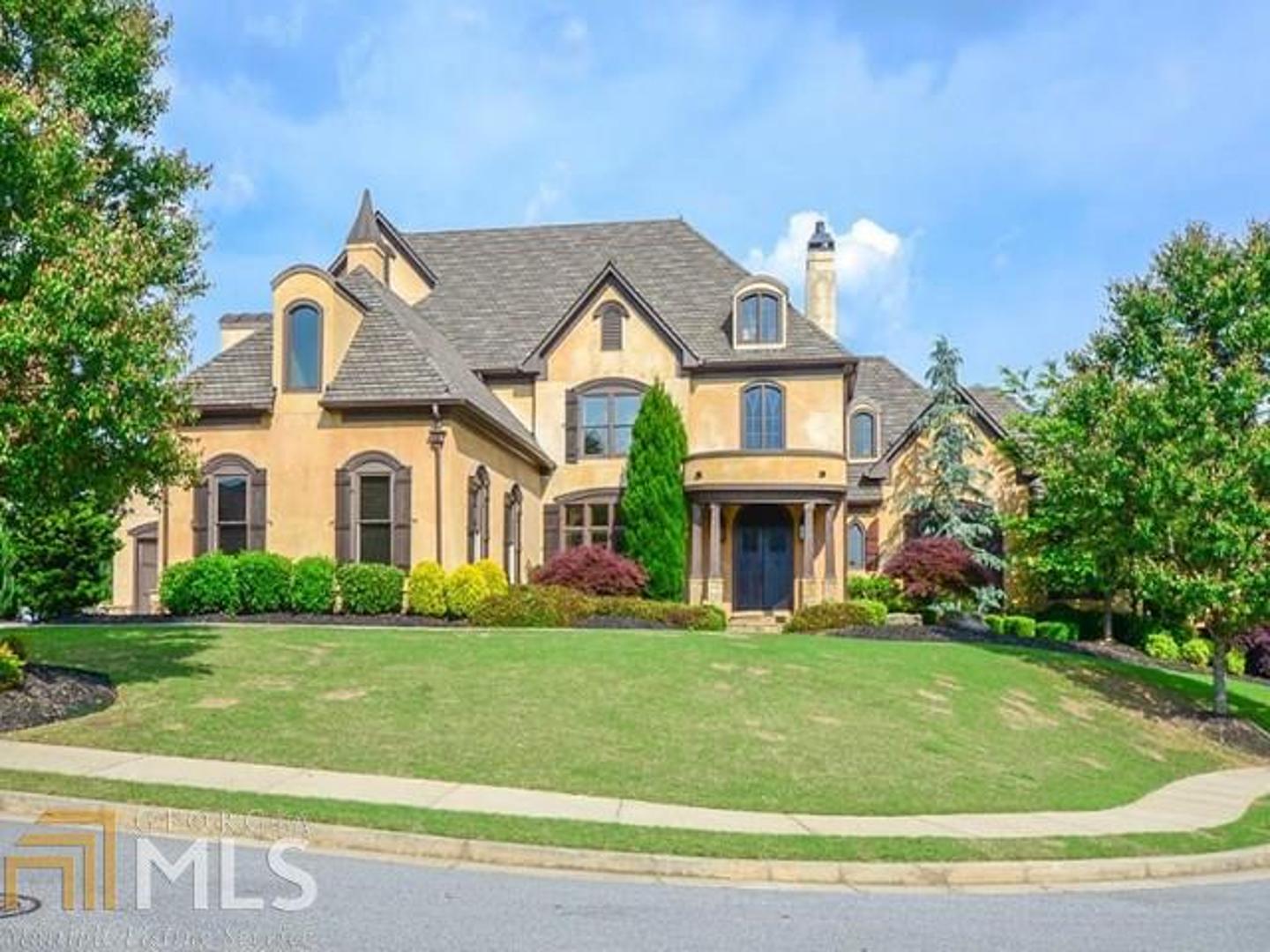 a front view of a house with a yard