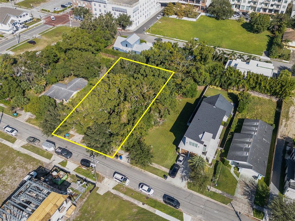 an aerial view of a residential houses with outdoor space