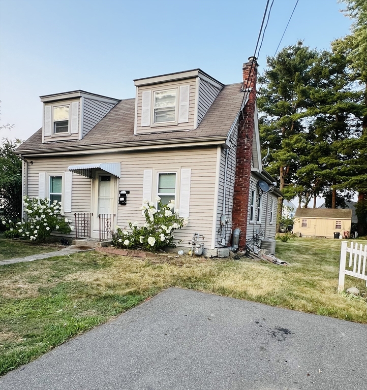 a front view of house with yard