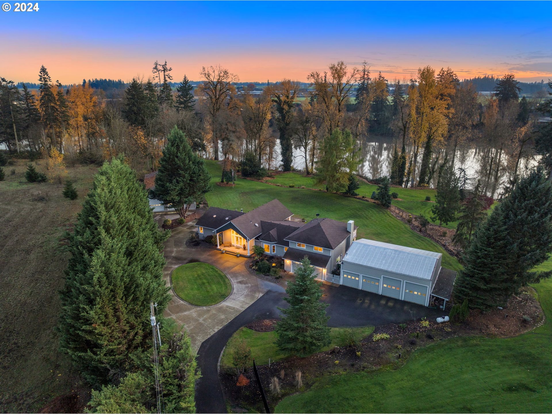 an aerial view of a house with garden space and street view