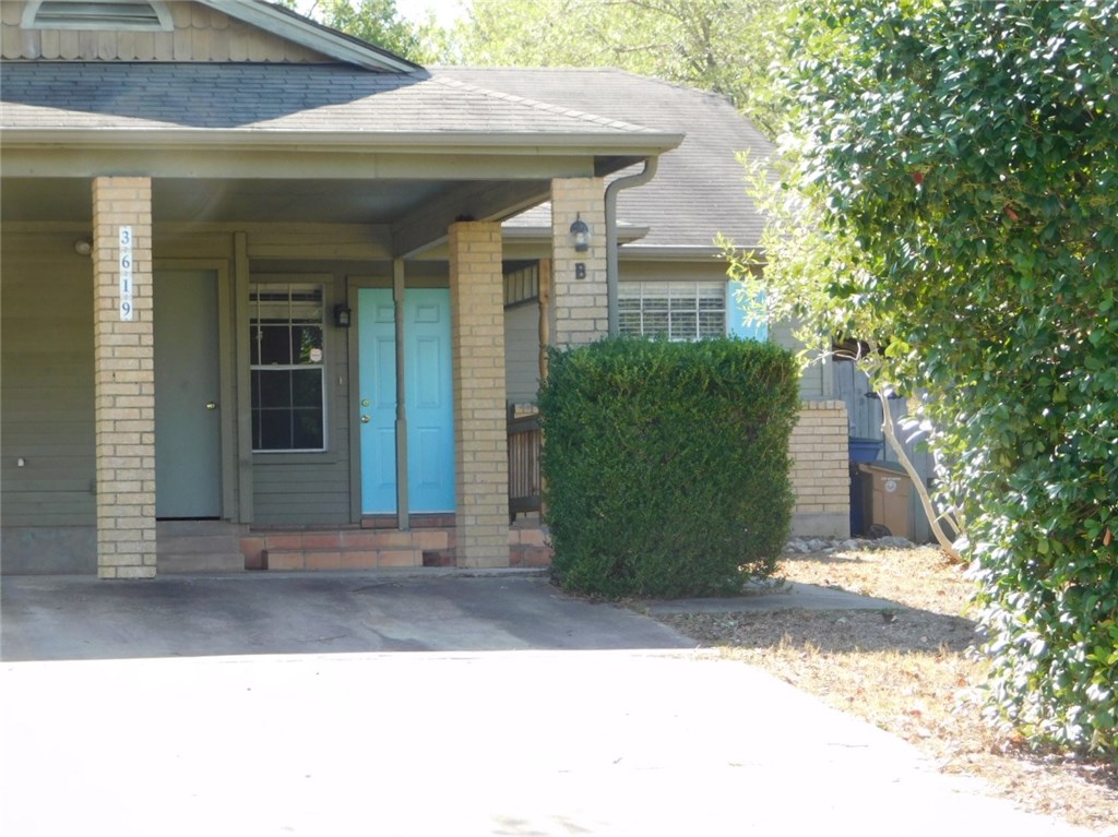 a view of a house with a garden