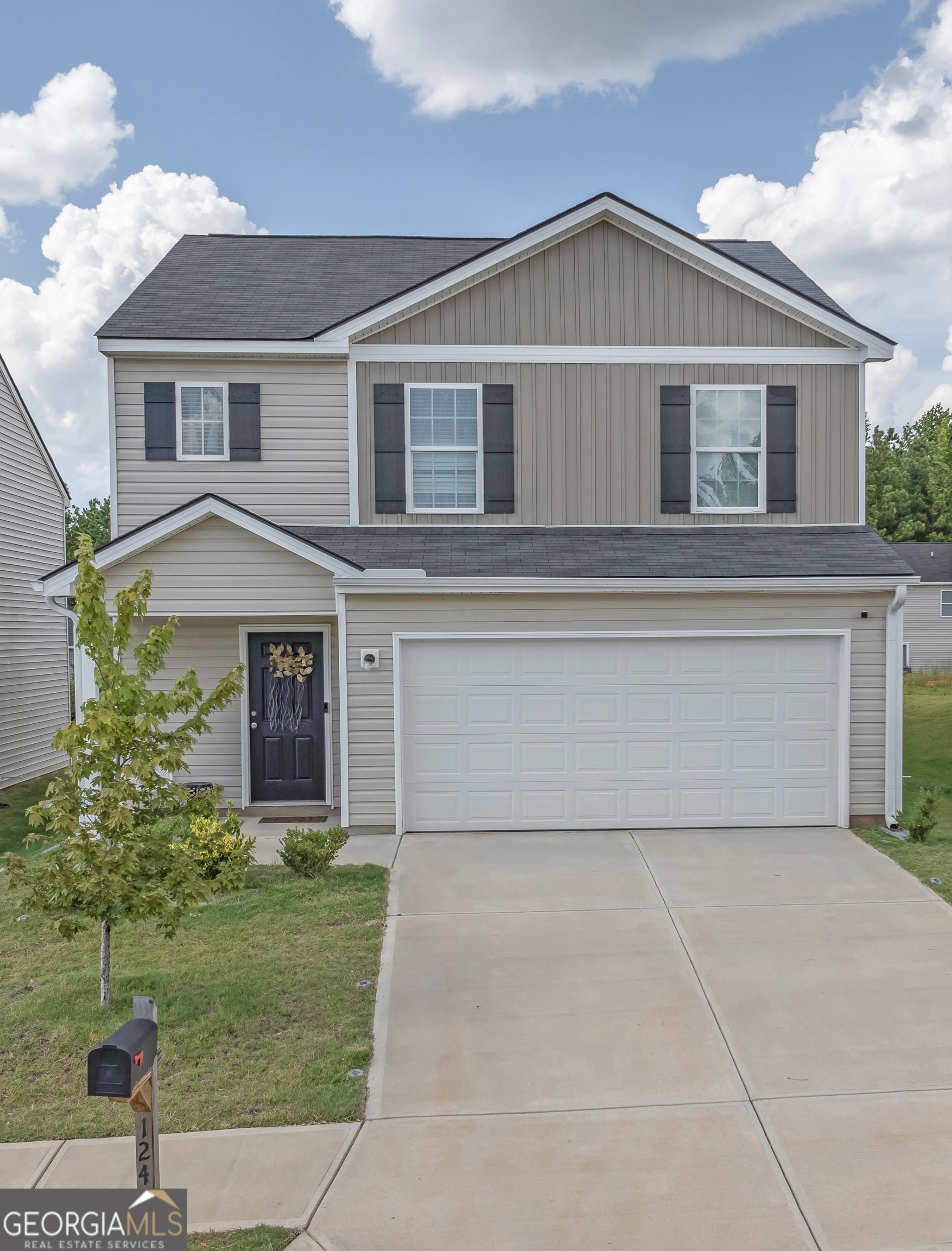 a front view of a house with a yard