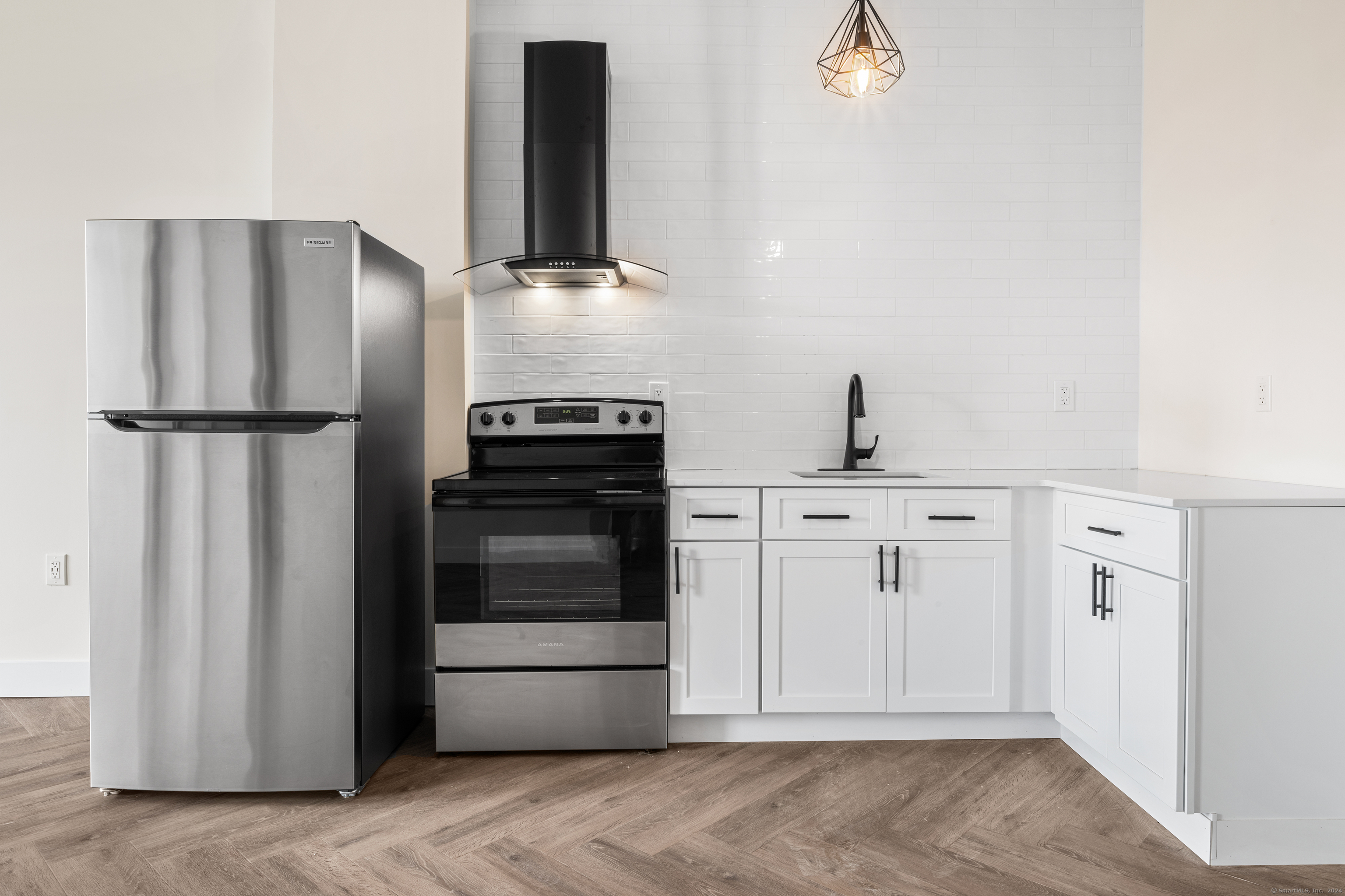 a kitchen with appliances and cabinets