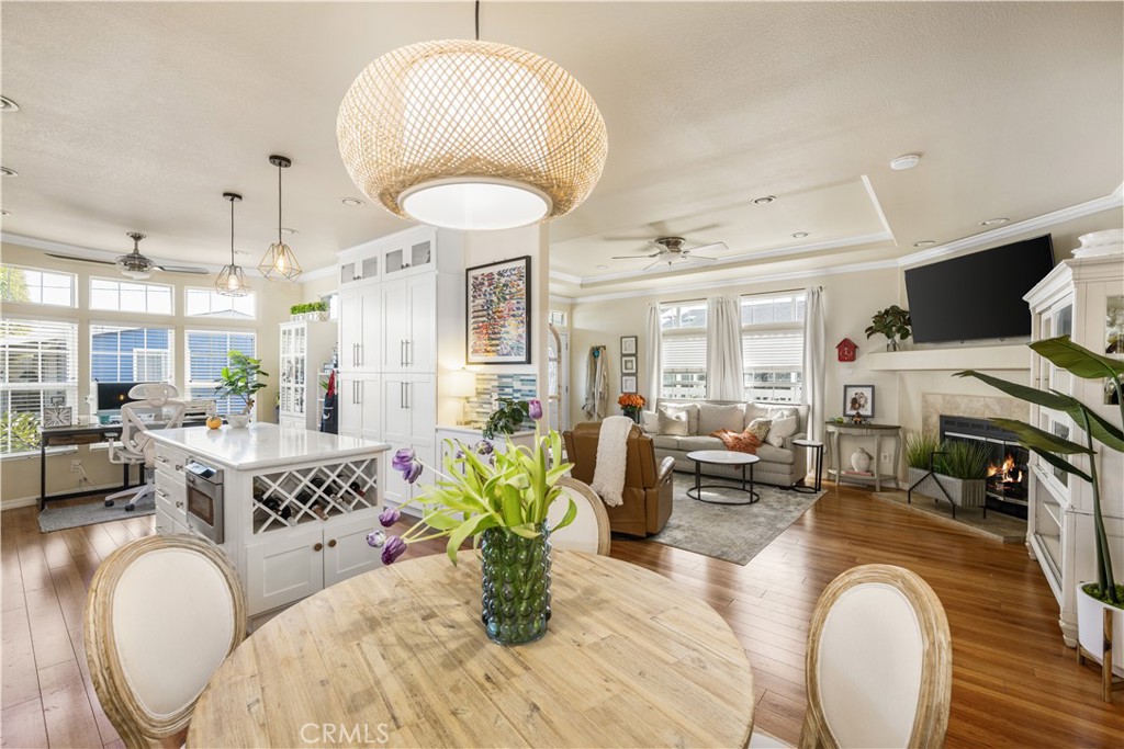 a living room with fireplace furniture and a chandelier