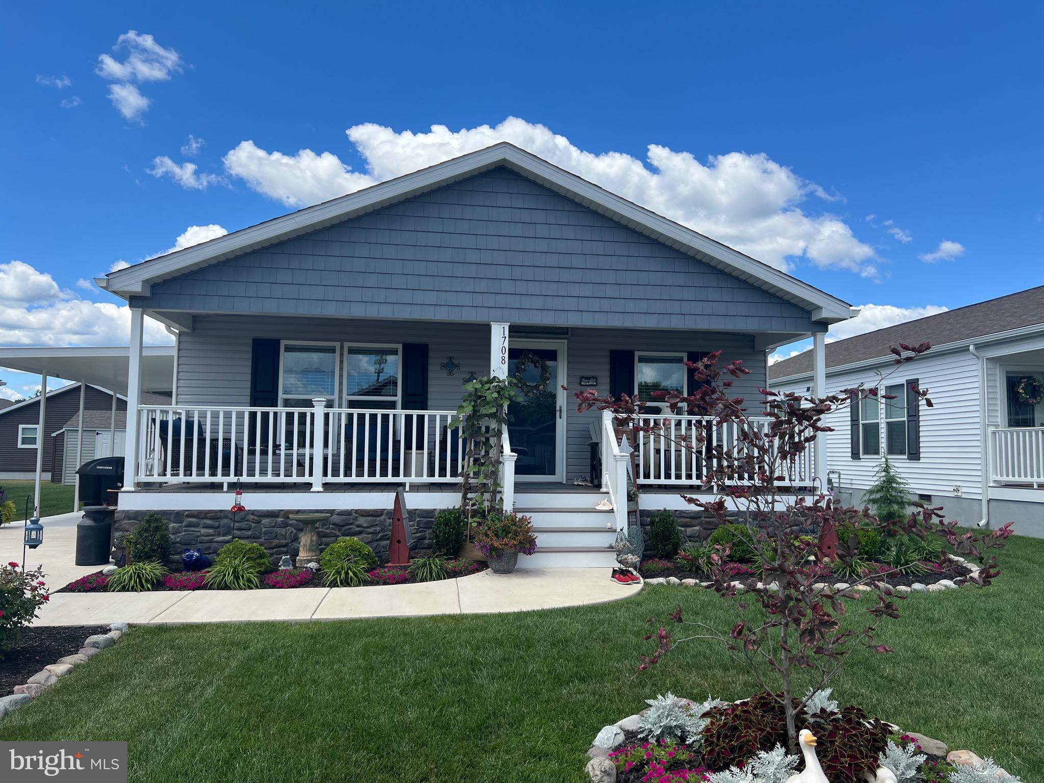 a view of a house with a yard and deck