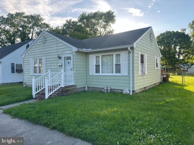 a view of a house with a yard and deck