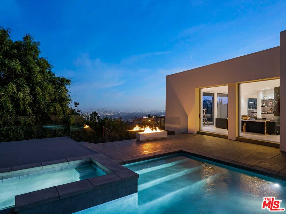 a view of a patio with swimming pool